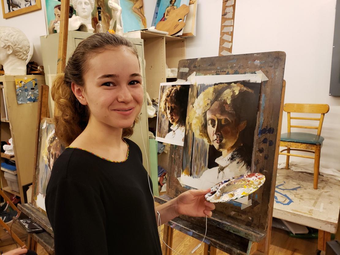 Sophia painting a portrait in oils.  Sophia painting a portrait in oils.